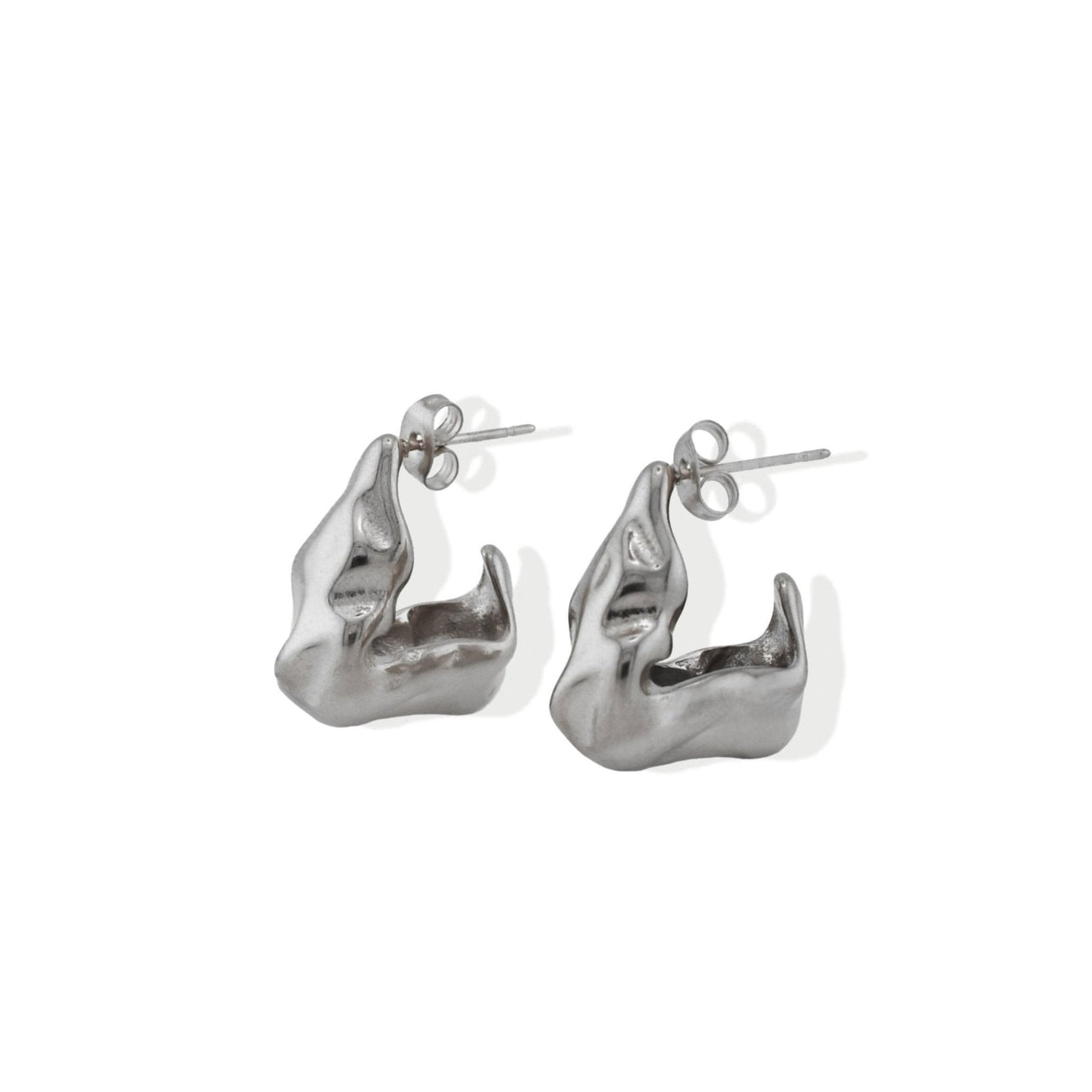 A pair of chunky, hammered, open hoop earrings in gold color with an irregular texture.